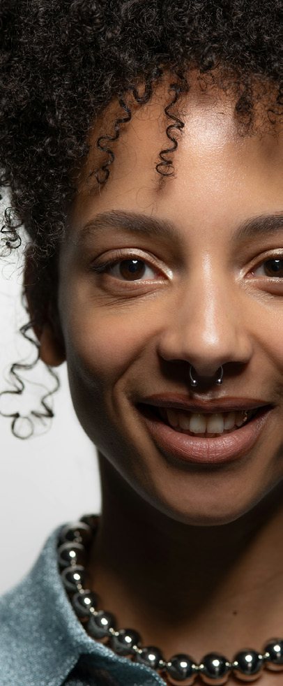 Woman with curly hair smiling